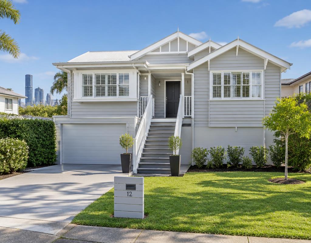 Weatherboard cottage exterior repainted in warm off-white